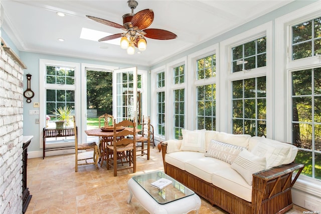 sunroom with a wealth of natural light and a skylight