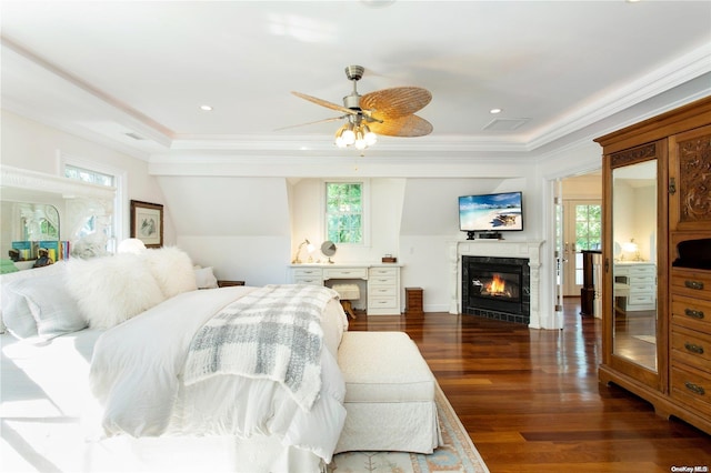 bedroom with dark hardwood / wood-style flooring, multiple windows, crown molding, and ceiling fan