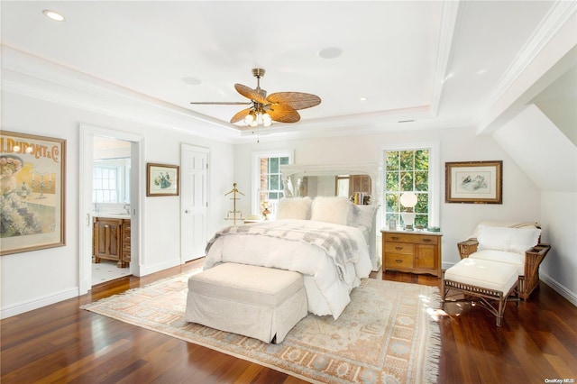 bedroom featuring connected bathroom, dark hardwood / wood-style floors, ceiling fan, and crown molding