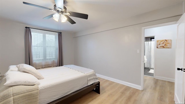 bedroom featuring ceiling fan and light wood-type flooring