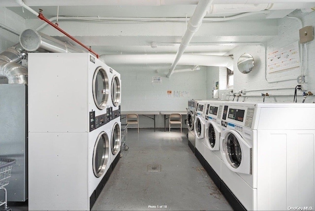 laundry room with washing machine and dryer and stacked washer and dryer