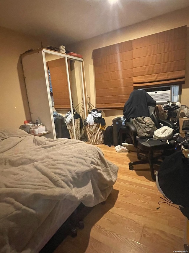 bedroom featuring a closet and hardwood / wood-style flooring