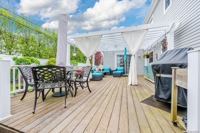 wooden terrace featuring an outdoor living space