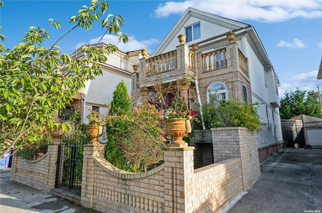 view of front of property with a balcony