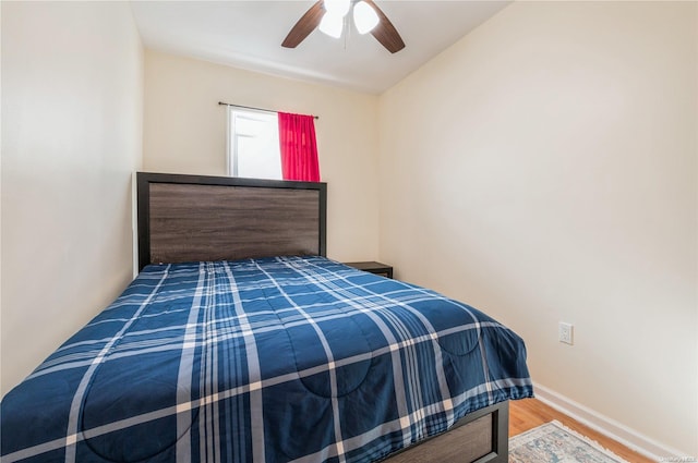 bedroom featuring hardwood / wood-style flooring and ceiling fan