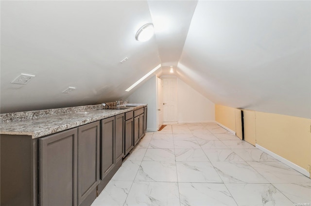 additional living space featuring vaulted ceiling