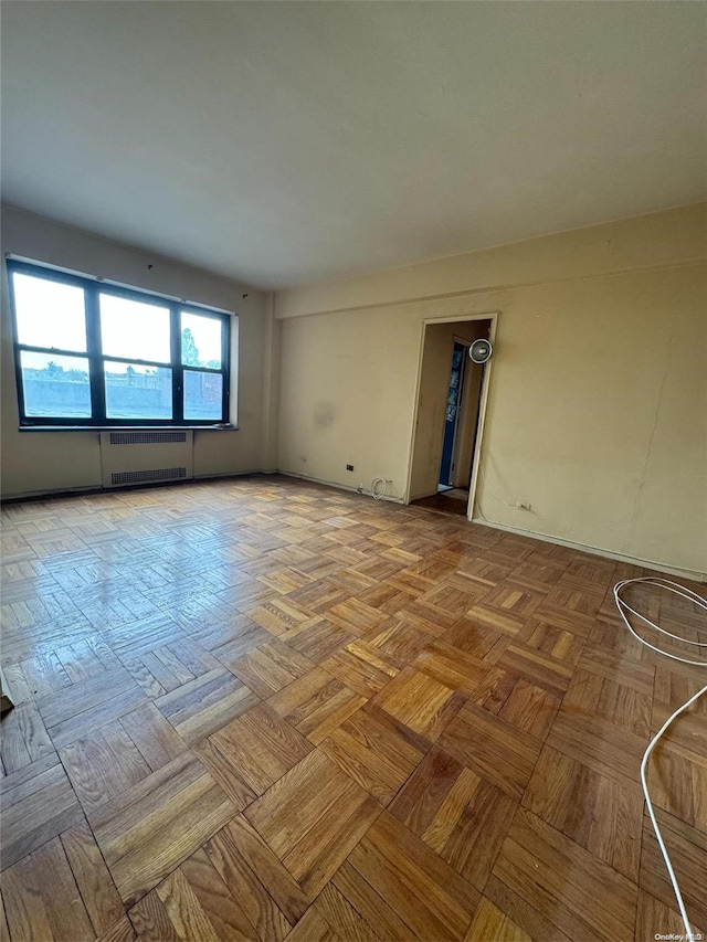 67-76 Booth St Unit 1G, Forest Hills, NY 11375 - empty room featuring radiator