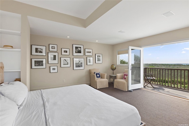 carpeted bedroom featuring access to exterior