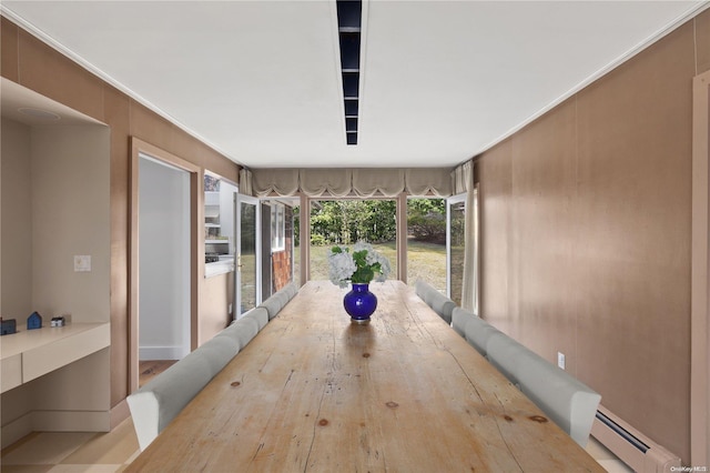 unfurnished sunroom with a baseboard radiator