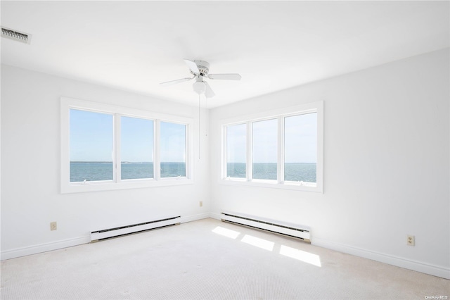 4235 Camp Mineola Rd, Mattituck, NY 11952 - unfurnished room featuring baseboard heating, ceiling fan, a water view, and baseboards