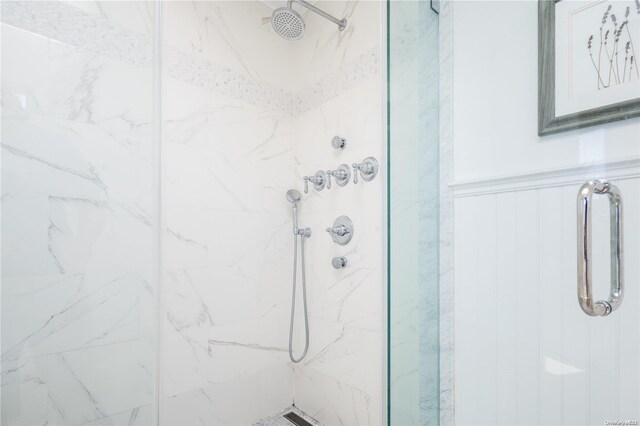 4235 Camp Mineola Rd, Mattituck, NY 11952 - full bathroom featuring a marble finish shower and wainscoting
