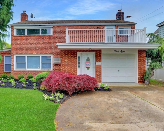 view of front facade with a front yard, a balcony, and a garage