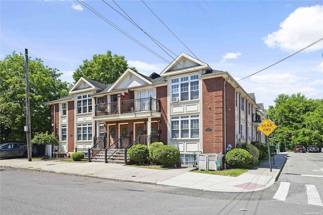 multi unit property featuring a balcony