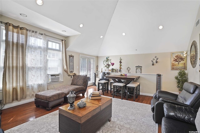 living room featuring cooling unit, dark wood-type flooring, and vaulted ceiling