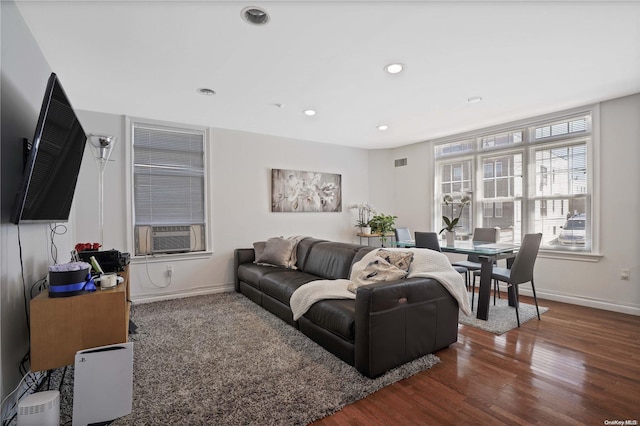 living room with cooling unit and dark wood-type flooring