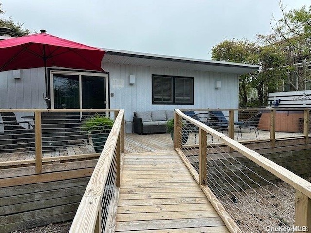 wooden deck featuring an outdoor hangout area