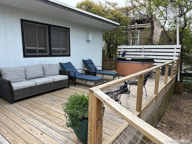 wooden deck featuring an outdoor hangout area