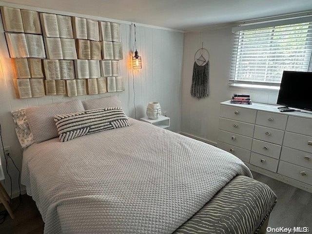 bedroom featuring wood-type flooring