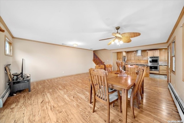 dining room featuring baseboard heating, crown molding, light hardwood / wood-style flooring, and ceiling fan