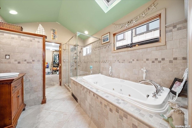 bathroom with lofted ceiling and tile walls