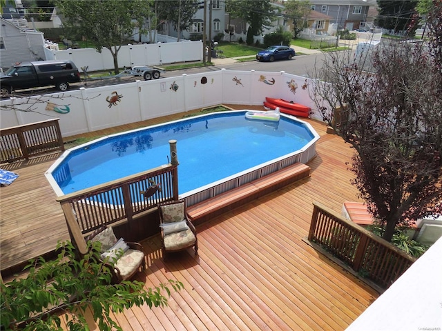 view of pool featuring a wooden deck