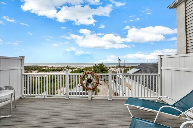 deck featuring a water view