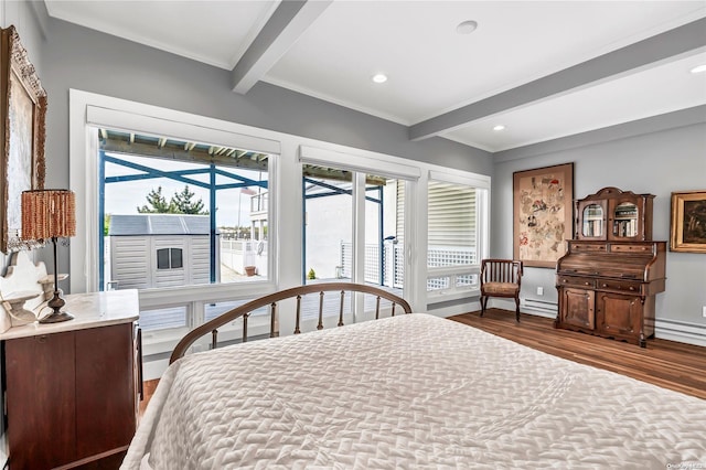 bedroom featuring beam ceiling, access to exterior, crown molding, and hardwood / wood-style floors