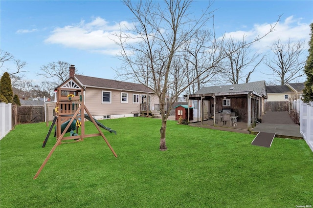 view of yard with a playground and a patio