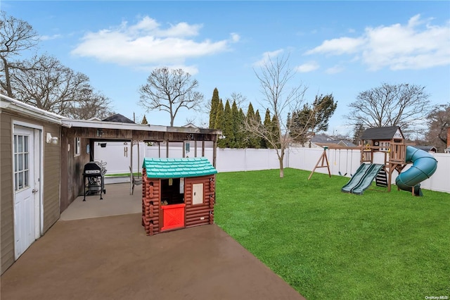 view of yard with a patio area and a playground