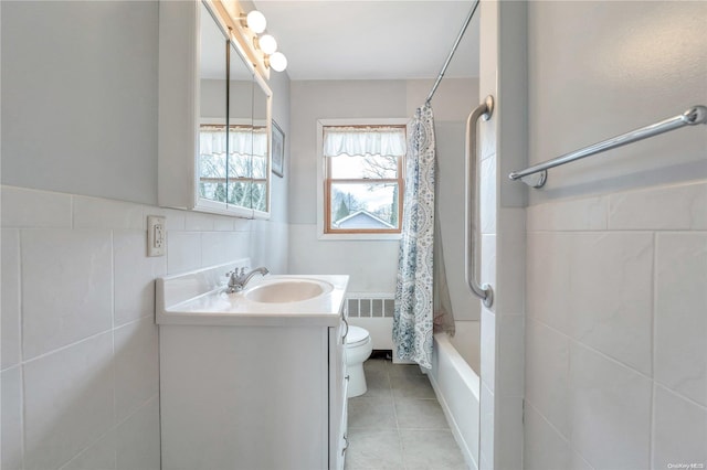 full bathroom with radiator, tile walls, vanity, toilet, and shower / bathtub combination with curtain