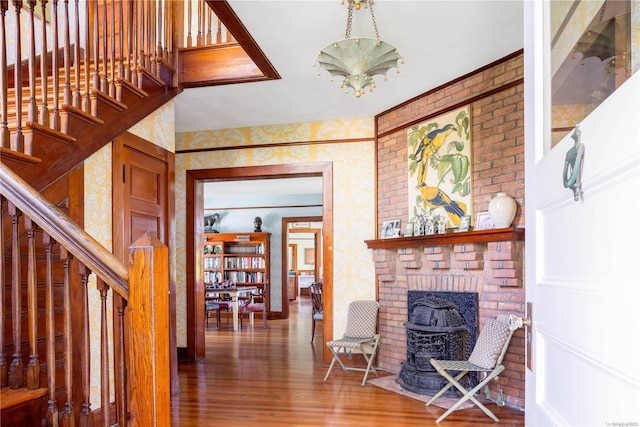 living room with an inviting chandelier and hardwood / wood-style flooring