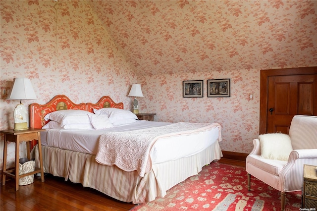 bedroom with dark wood-type flooring