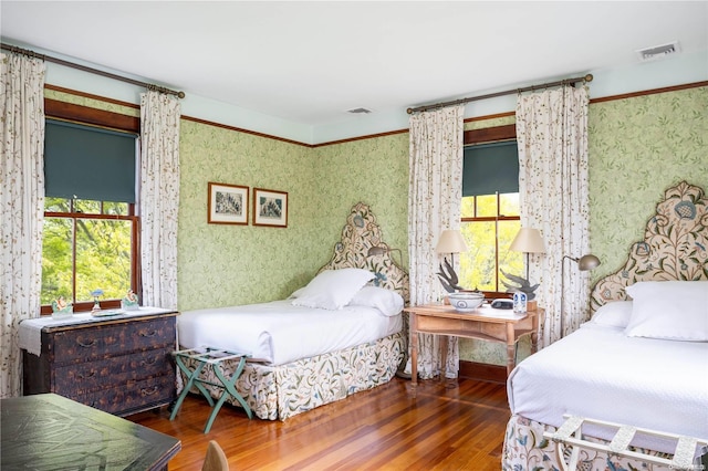 bedroom featuring dark hardwood / wood-style flooring