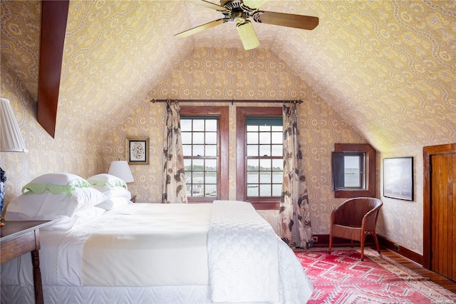 bedroom with ceiling fan and lofted ceiling