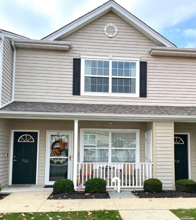 multi unit property featuring a porch