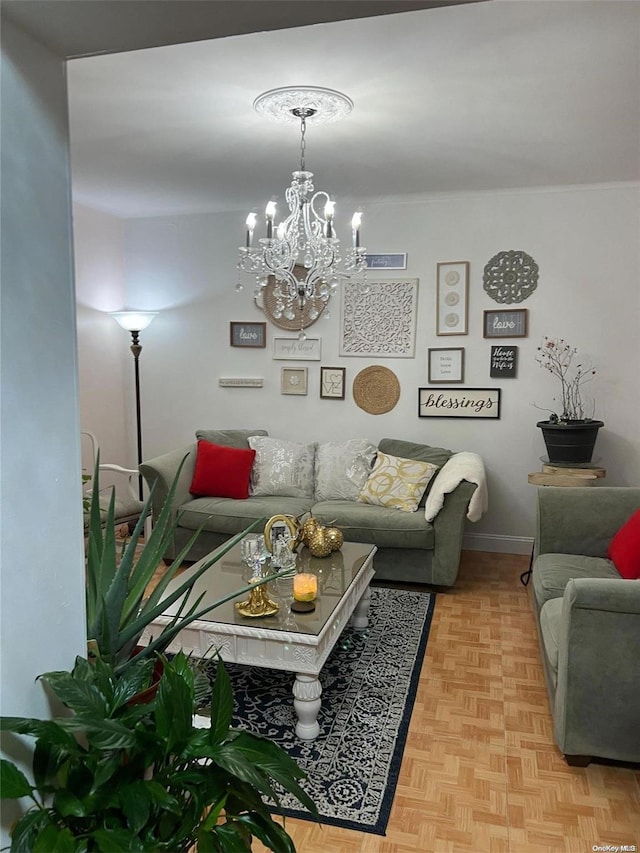 living room with light parquet floors and a notable chandelier