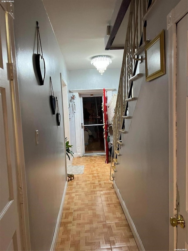 corridor with light parquet flooring