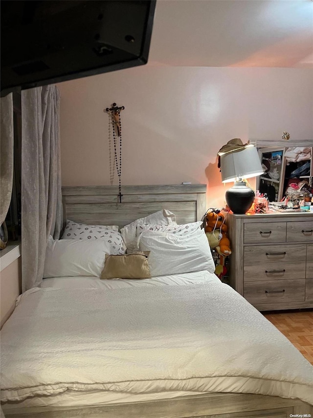 bedroom featuring light parquet floors