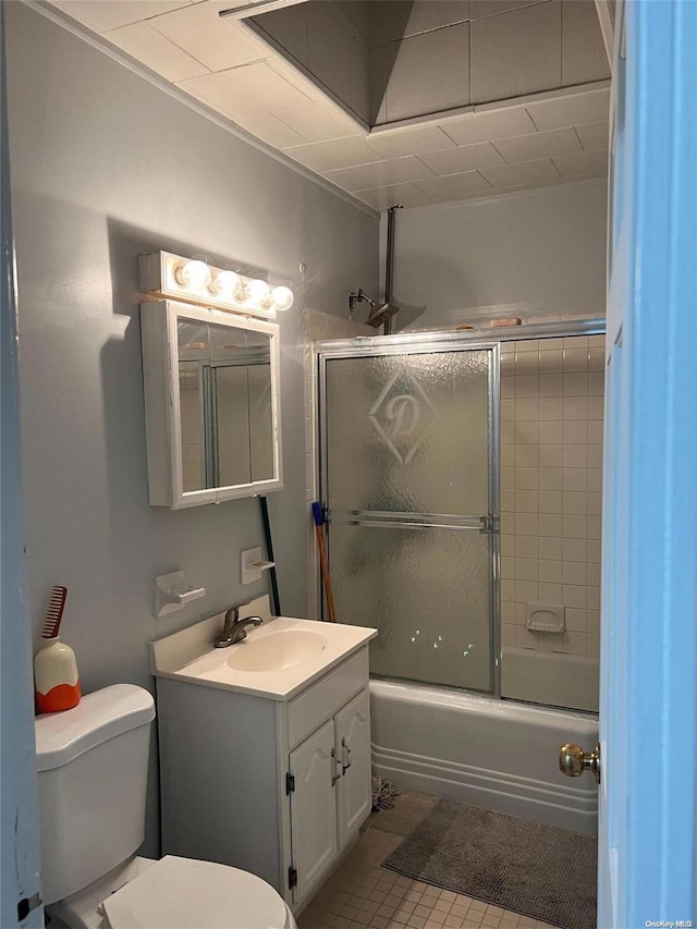 full bathroom featuring shower / bath combination with glass door, tile patterned flooring, vanity, and toilet