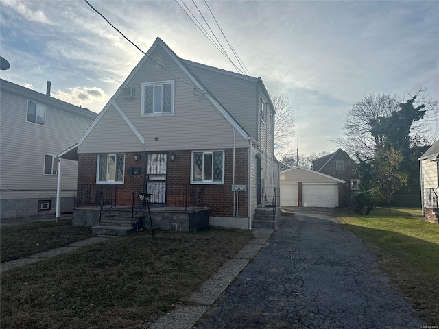 view of front facade featuring an outbuilding and a garage