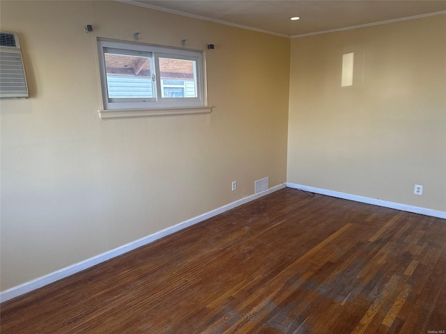 unfurnished room featuring crown molding and dark wood-type flooring