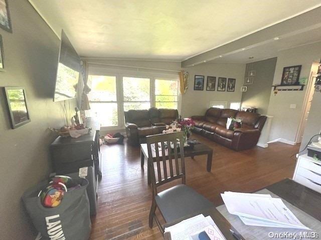 living room featuring dark wood-type flooring