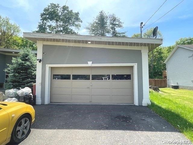 garage with a yard