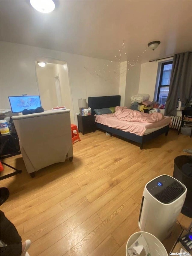 bedroom featuring light wood-type flooring