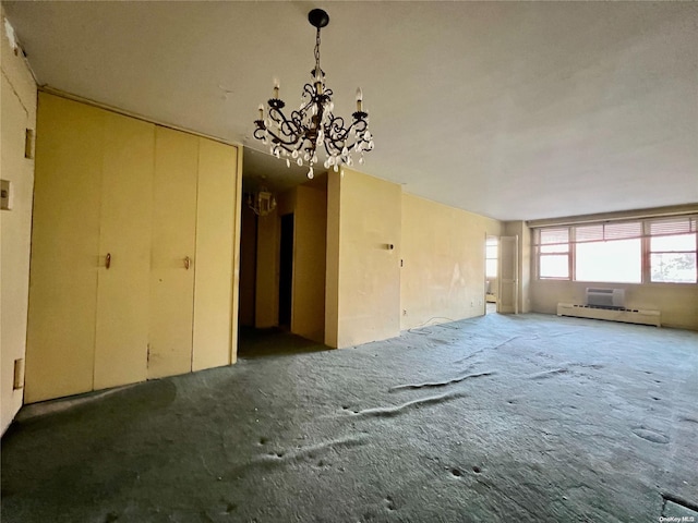 miscellaneous room with a baseboard radiator and an inviting chandelier