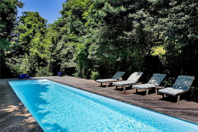 view of swimming pool featuring a wooden deck