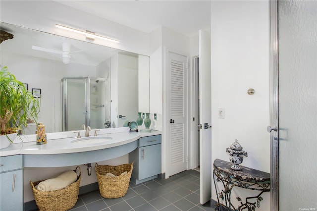 bathroom featuring tile patterned floors, ceiling fan, sink, and a shower with shower door