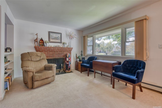 sitting room with light colored carpet, a baseboard radiator, and a brick fireplace