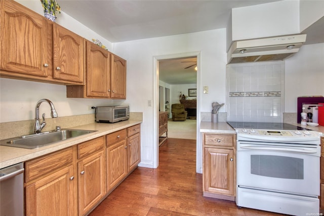 kitchen featuring dishwasher, dark wood-type flooring, sink, tasteful backsplash, and white electric range oven