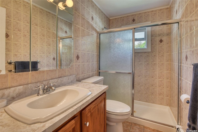 bathroom with tile patterned floors, toilet, tile walls, and walk in shower